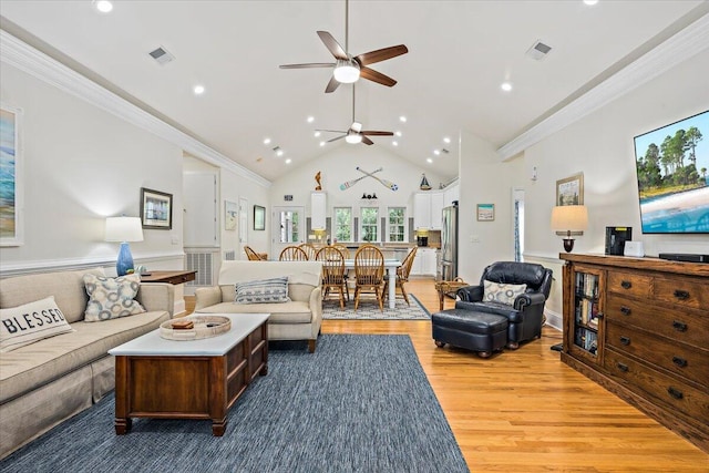 1604 Jungle Rd, Edisto Island, SC 29438 - living room featuring light wood-style flooring, a ceiling fan, recessed lighting, crown molding, and high vaulted ceiling