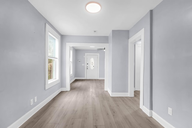 hall with light wood-type flooring