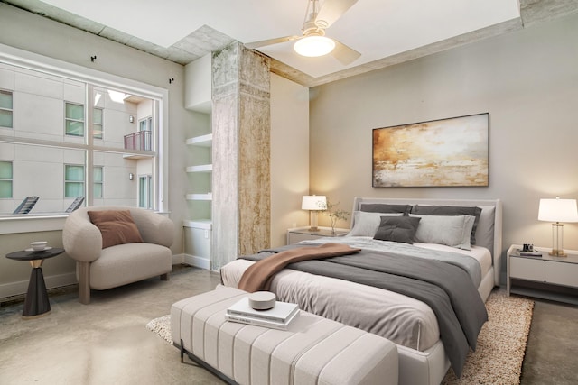 bedroom with ceiling fan and concrete floors