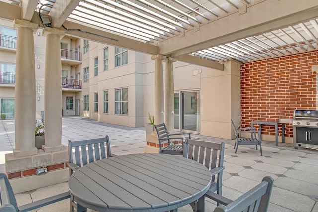 view of patio / terrace with a pergola and grilling area