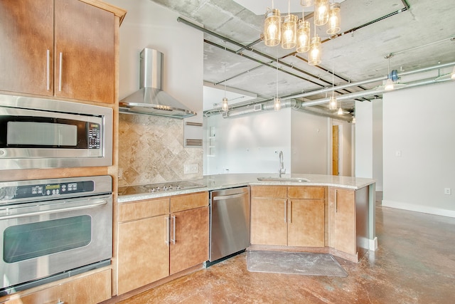 kitchen featuring wall chimney exhaust hood, sink, decorative light fixtures, stainless steel appliances, and backsplash