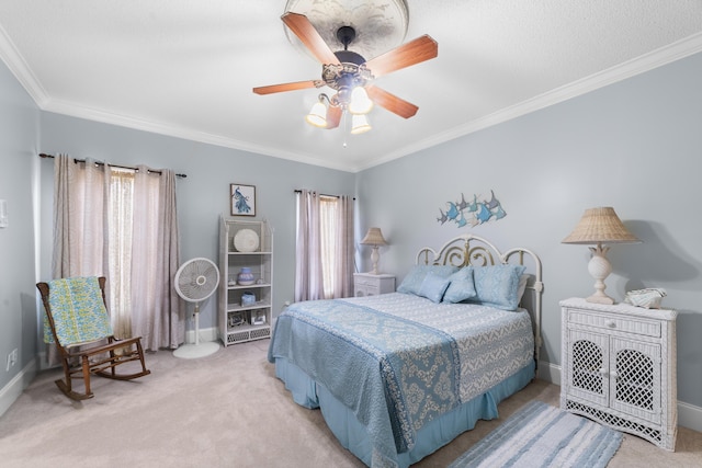 bedroom featuring crown molding, light carpet, and ceiling fan