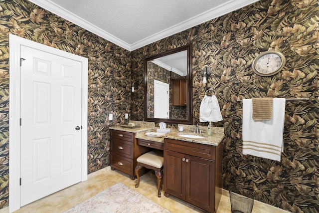 bathroom with vanity, ornamental molding, and a textured ceiling