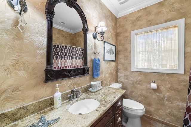 bathroom with vanity, tile patterned flooring, crown molding, and toilet