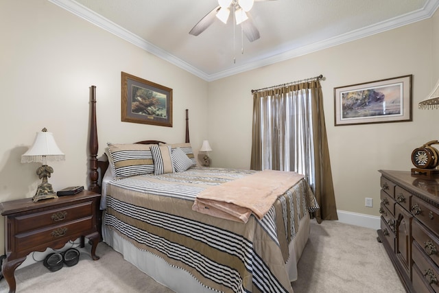 carpeted bedroom featuring ornamental molding and ceiling fan