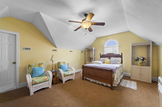 carpeted bedroom with ceiling fan, lofted ceiling, and a textured ceiling