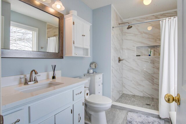 bathroom featuring walk in shower, oversized vanity, toilet, and tile flooring