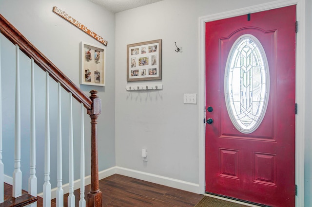 foyer entrance with dark wood-type flooring