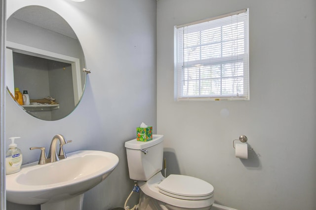 bathroom with sink and toilet