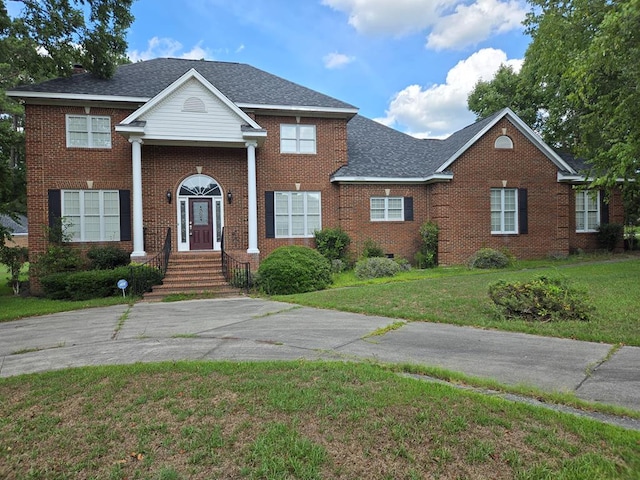 view of front of home with a front yard