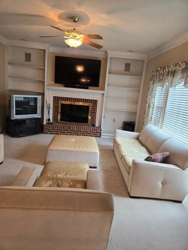 carpeted living room with ceiling fan, a textured ceiling, a brick fireplace, and ornamental molding