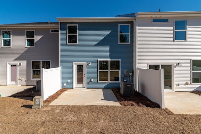 back of house featuring central air condition unit, a patio, and fence