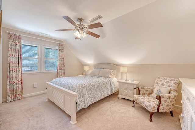 bedroom featuring light carpet, vaulted ceiling, ceiling fan, and baseboards