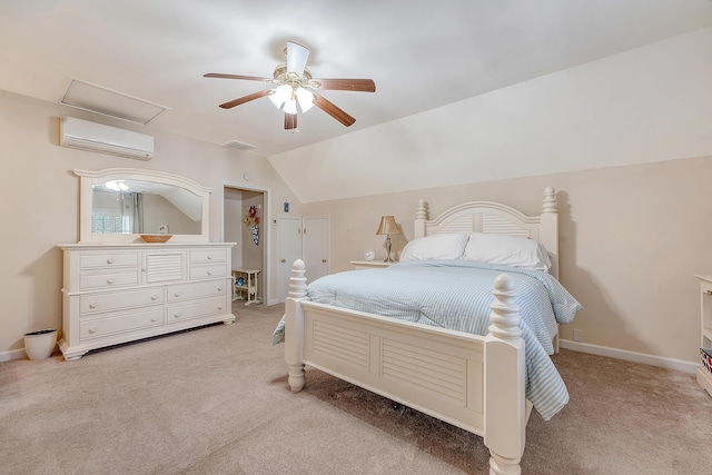 bedroom featuring a wall mounted air conditioner, light colored carpet, vaulted ceiling, a ceiling fan, and attic access