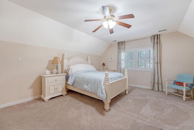 bedroom featuring lofted ceiling, light carpet, ceiling fan, and baseboards