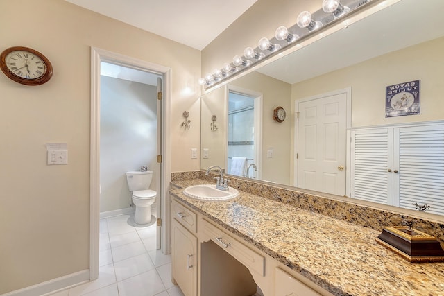 bathroom with tile patterned flooring, toilet, vanity, baseboards, and a shower