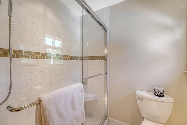 full bath with a shower stall and toilet