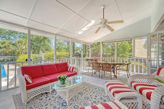 sunroom / solarium with outdoor lounge area, ceiling fan, healthy amount of natural light, and vaulted ceiling