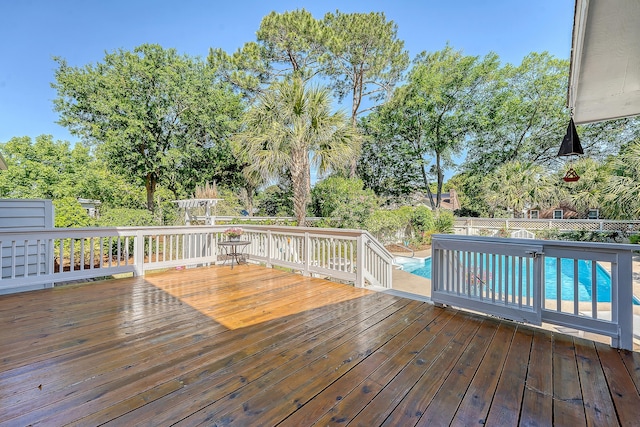 deck with a fenced backyard and view of scattered trees