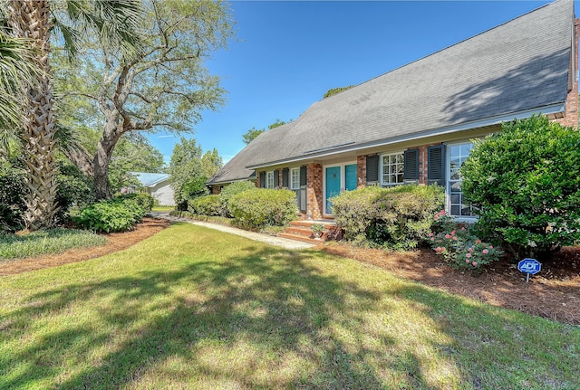 view of home's exterior featuring a yard