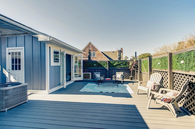 wooden deck with central AC unit