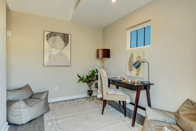 office space featuring baseboards and wood finished floors