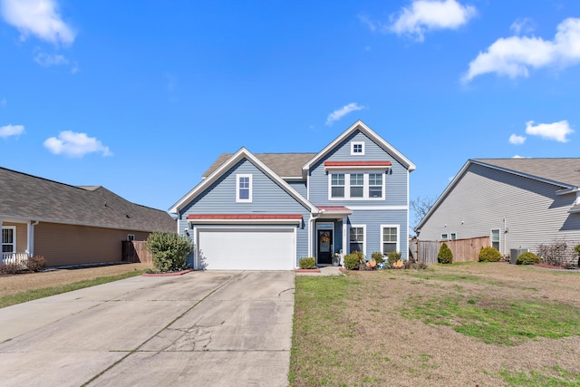 view of front facade featuring an attached garage, fence, a front lawn, and concrete driveway