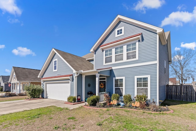 traditional home featuring concrete driveway, a porch, a front yard, and fence