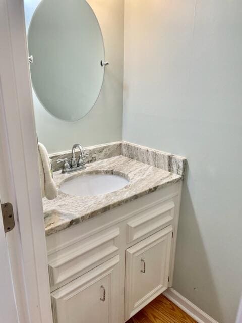 bathroom featuring hardwood / wood-style floors and vanity