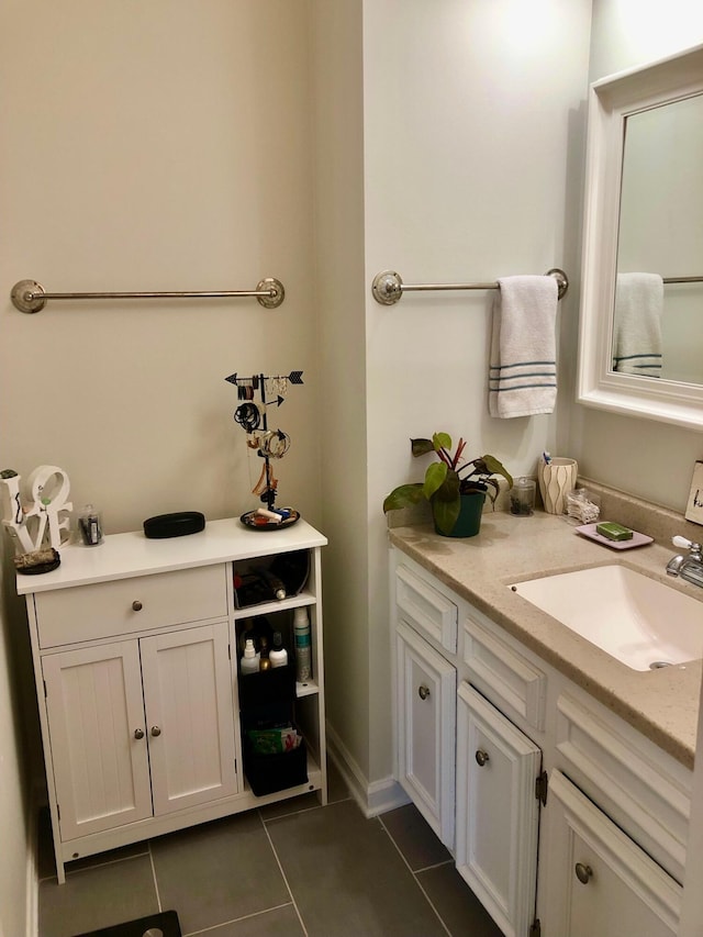 bathroom with tile patterned flooring and vanity