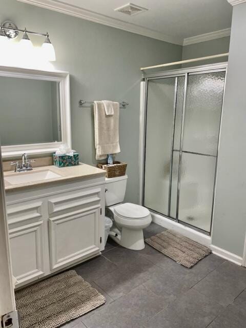 bathroom featuring tile patterned flooring, vanity, walk in shower, and ornamental molding