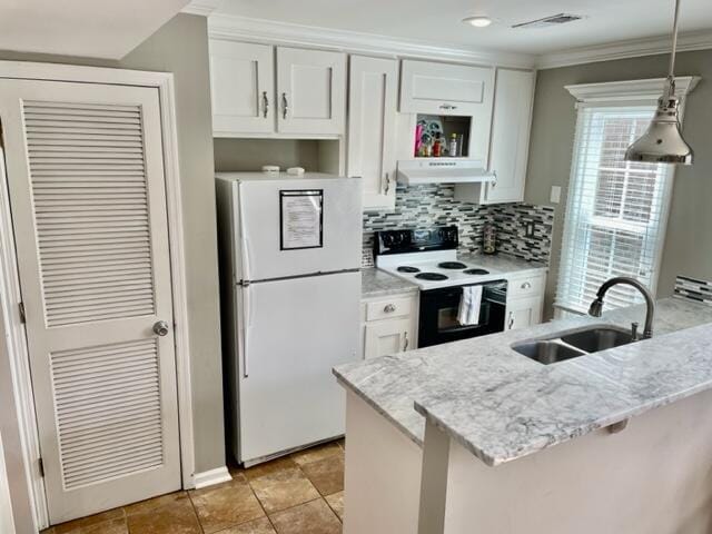 kitchen with white cabinets, white appliances, light stone counters, and sink