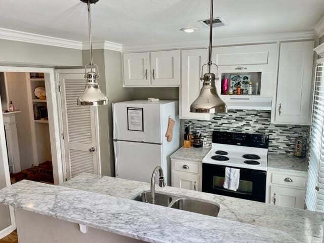 kitchen featuring sink, white cabinets, and white appliances