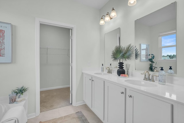 bathroom featuring vanity, a bath, and tile patterned flooring