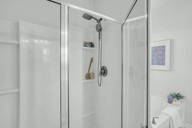 bathroom with shower with separate bathtub