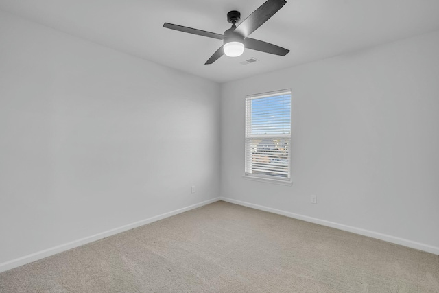 unfurnished room with carpet flooring and ceiling fan