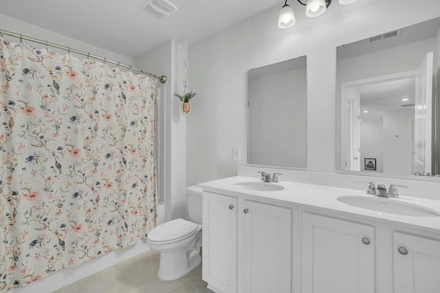 full bathroom featuring vanity, toilet, tile patterned flooring, and shower / tub combo