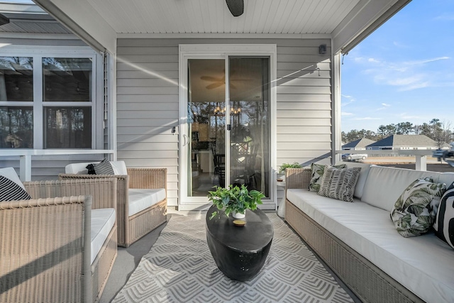 exterior space with an outdoor hangout area, ceiling fan, and a patio area