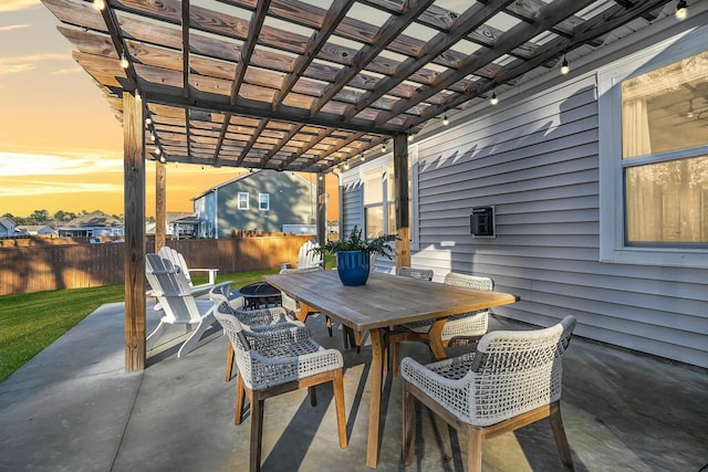 patio terrace at dusk with a pergola