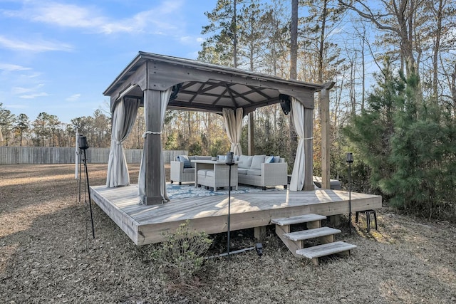 wooden deck with a gazebo and outdoor lounge area