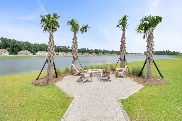 view of patio / terrace with a water view and a fire pit