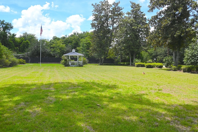 view of yard with a gazebo and fence