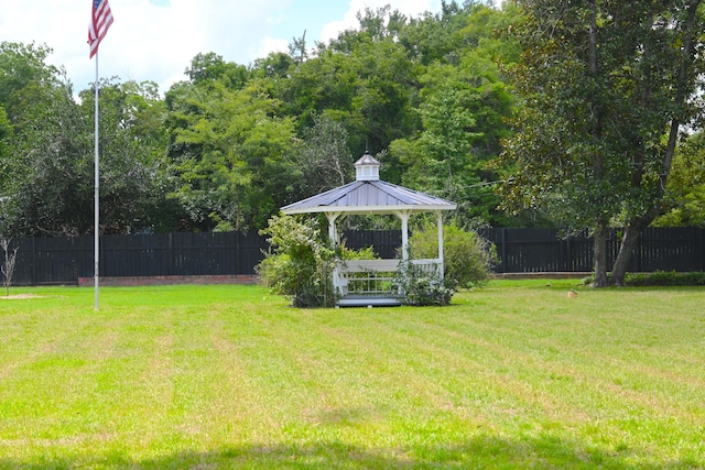 view of yard with a gazebo and a fenced backyard
