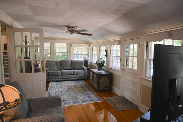living area featuring wood finished floors, plenty of natural light, a ceiling fan, and lofted ceiling
