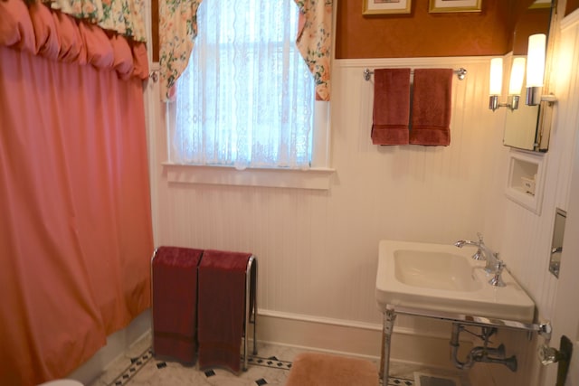 bathroom featuring a sink and tile patterned flooring