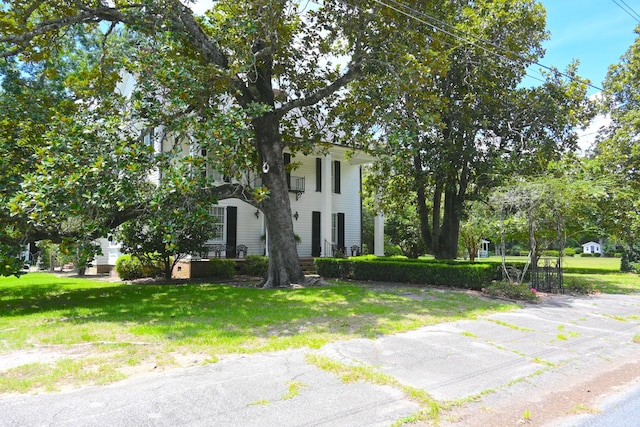neoclassical / greek revival house with a front yard