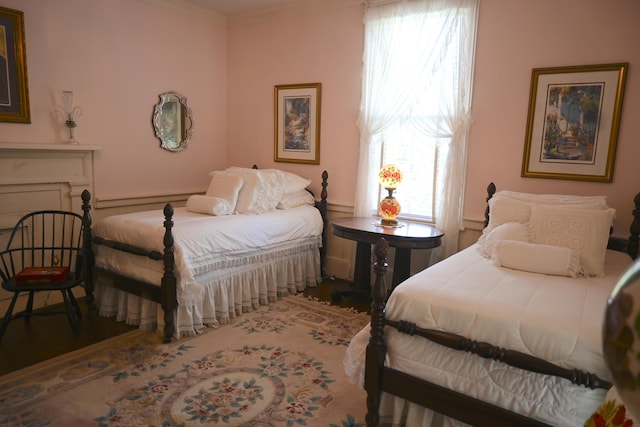 bedroom featuring ornamental molding and a baseboard radiator