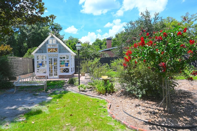 exterior space with an outbuilding and a fenced backyard