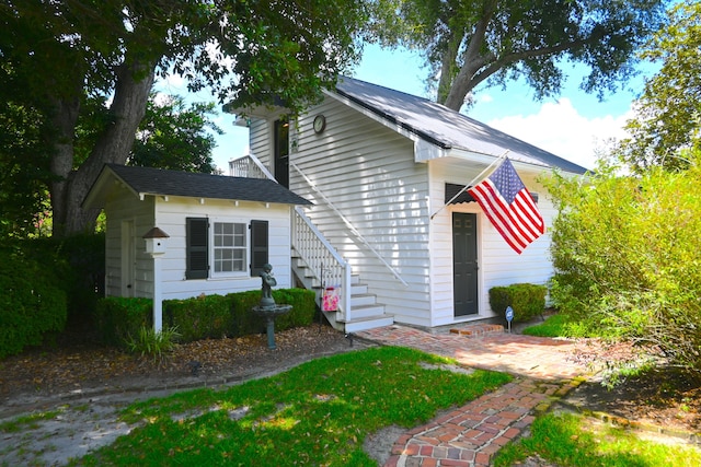 view of front of house with stairs