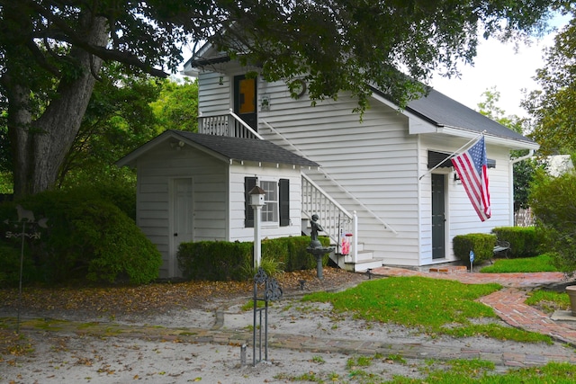 view of front facade featuring stairs